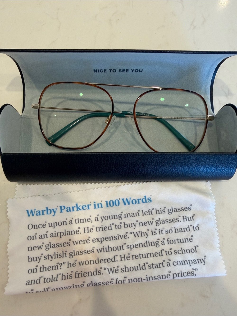 Warby Parker Gold and Tortoiseshell Frames with Teal Temples